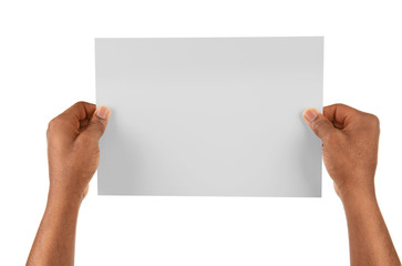 Male hands holding sheet of paper isolated on white