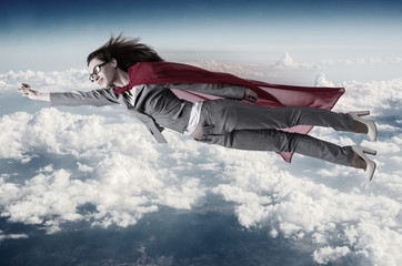 Superwoman flying above the skies