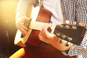 Fototapeta premium Man playing acoustic guitar