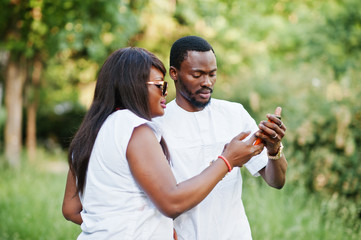 Fototapeta premium Black african couple in love doing selfie on they phone
