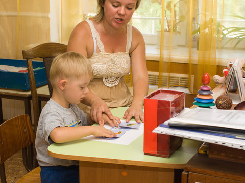 Psychologist and a child with Down syndrome
