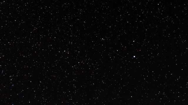 time lapse of the night sky with moving stars 