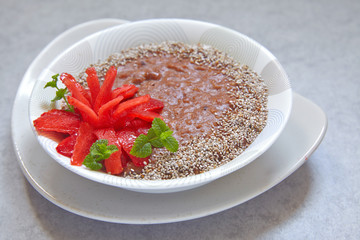 Chocolate oatmeal decorated with strawberry flower