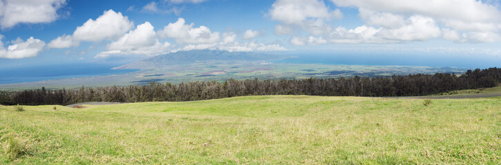 Fototapeta premium View of the plain between Kahului and Maalaea Bay seen from the lower slopes of Haleakala. The plain divides Maui in two.