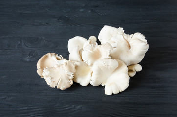 mushrooms black wooden table