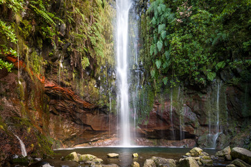 Beautiful waterfall an the hiking route levada 25 fountains, Madeira island, Portugal.