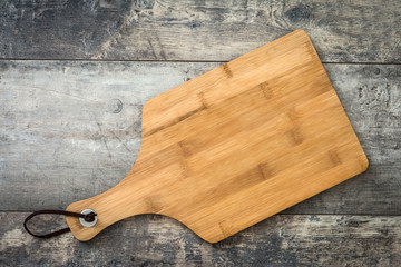 Cutting board on a wooden background
