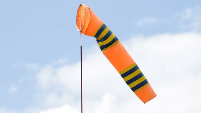 Flag of windsock in airport on blue sky