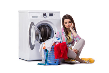 Woman tired after doing laundry isolated on white