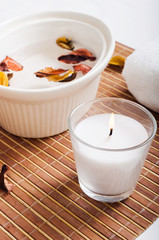 Spa items with a candle in the foreground