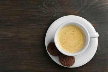 Cup of coffee on wooden background