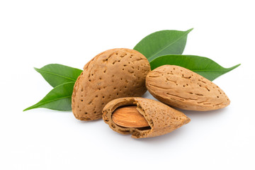 Almonds with leaves isolated on white background
