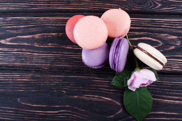 Multicolored macaroon on brown boards.