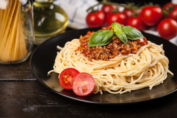 Spaghetti bolognese on dark background