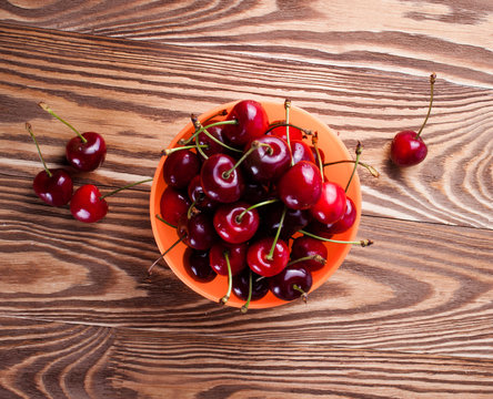 Cherry isolated on wood