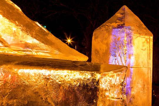 Ice sculptures with yellow and purple light highlights