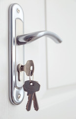 Metal door knob and keys closeup