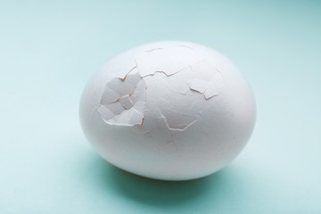 Cracked egg on white background