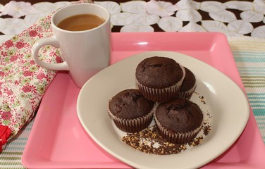 Chocolate muffins and a cup of coffee