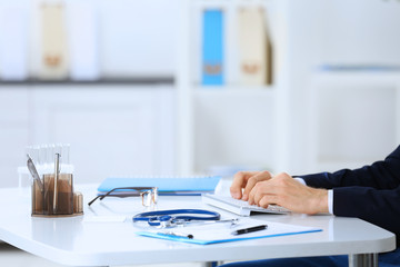 Doctor working at a computer in hospital