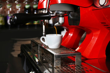 Coffee machine with cup, close-up