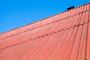 Obraz na płótnie Canvas Blue sky and red roof, background photo