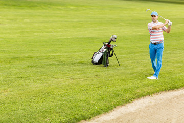 Man playing golf