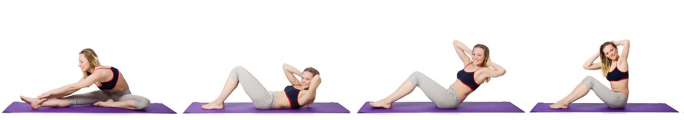 Fototapeta premium Young female doing exercises on white