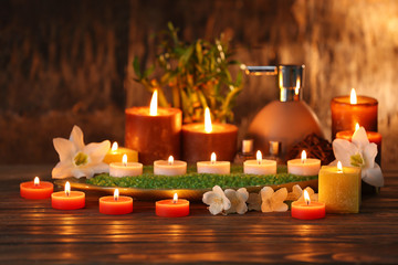 Fototapeta na wymiar Spa composition with candles on blurred background