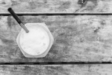 black and white of iced coffee on the table.(Iced Cappuccino)