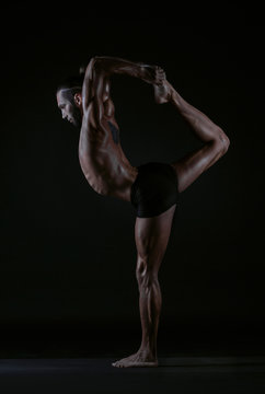 man practicing yoga, studio photo © vakidzasi
