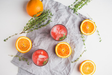 Cocktail made of Sicilian orange on the rustic wooden background