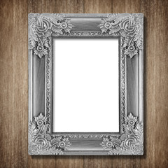 Antique frame on wooden wall background
