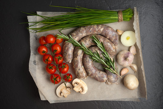 homemade sausages on a stone background