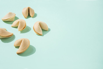 Fortune cookies on the green background - obrazy, fototapety, plakaty