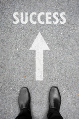 Fototapeta premium Black shoes standing on the road to success