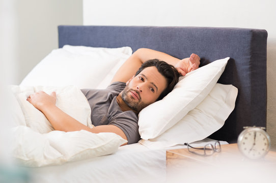 Man lying in bed