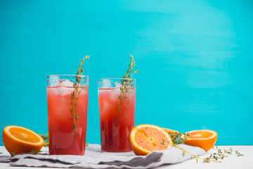 Cocktail made of Sicilian orange on the rustic wooden background