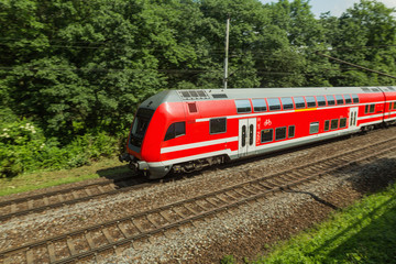 Fototapeta premium Red train is on the track in Saxony