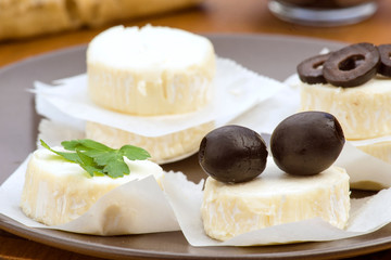 Lots of goat cheese with parsley and olives