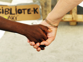 Black hand and white hand, mother of adoption, race mixing