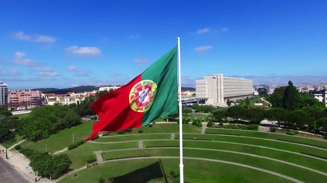 Portuguese Waving Flag in Eduardo VII Park in Lisbon, Portugal aerial view