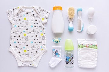 Top view of unisex newborn baby necessities.