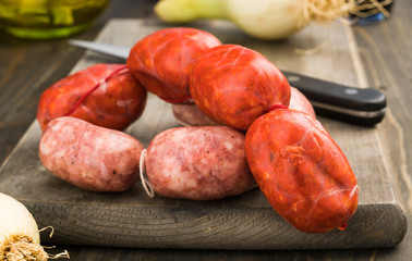 Spanish raw sausages on rustic wooden