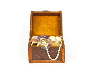 Open treasure chest with jewelry and money