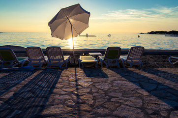 umbrella silhouette in the sunset on the beach