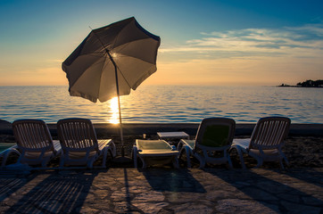 umbrella silhouette in the sunset on the beach