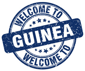 welcome to Guinea blue round vintage stamp