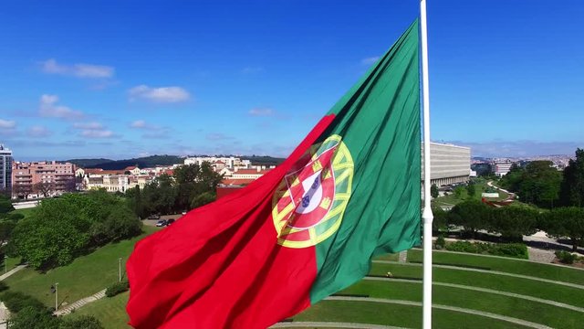 Portuguese Waving Flag in Eduardo VII Park in Lisbon, Portugal aerial view
