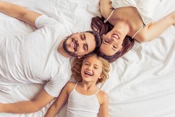 Happy family in the morning - Powered by Adobe